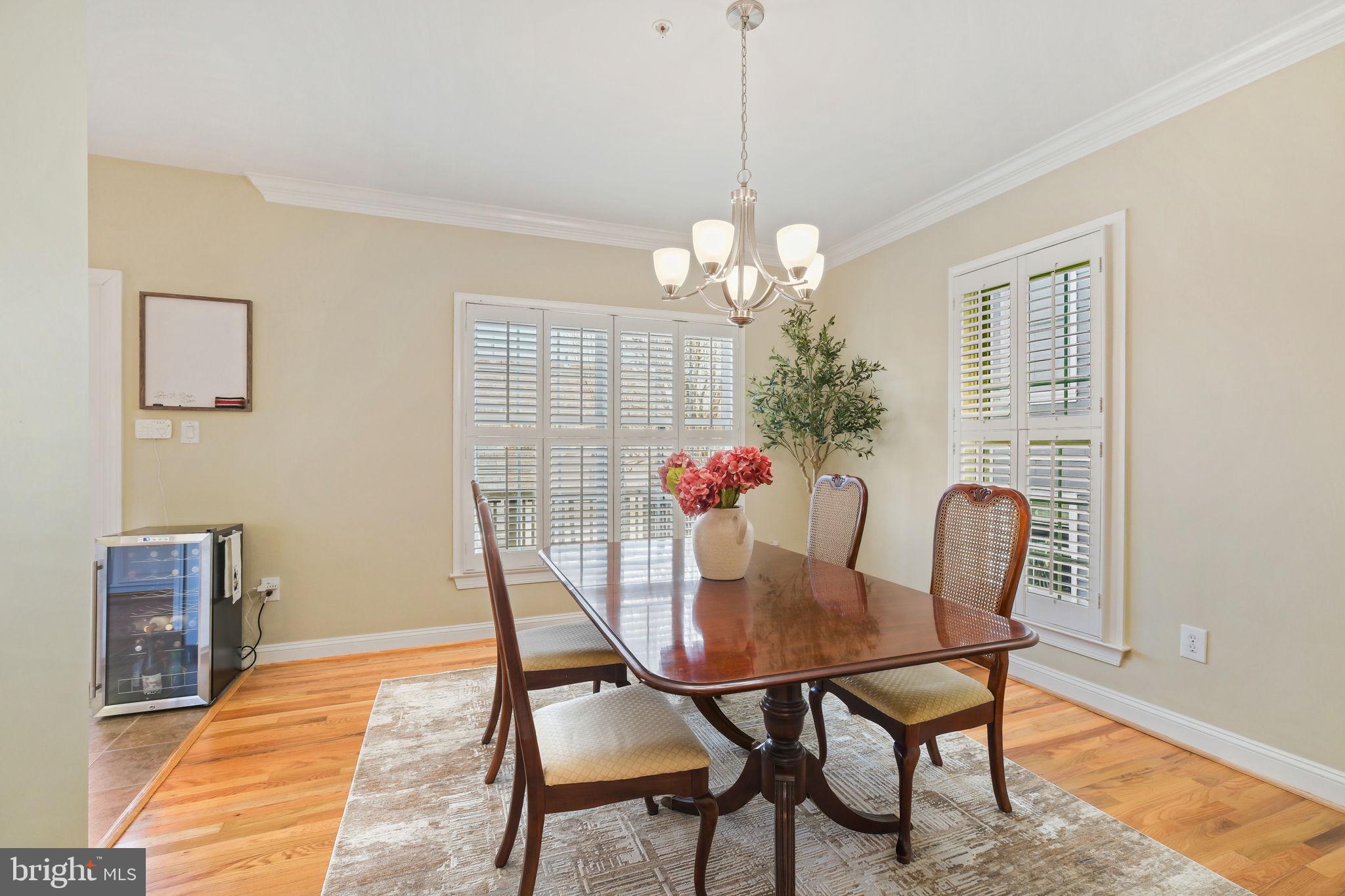 220 Thaxton Street Gaithersburg, MD 20878 - Photo 12 of 61 a view of a dining room with furniture and chandelier