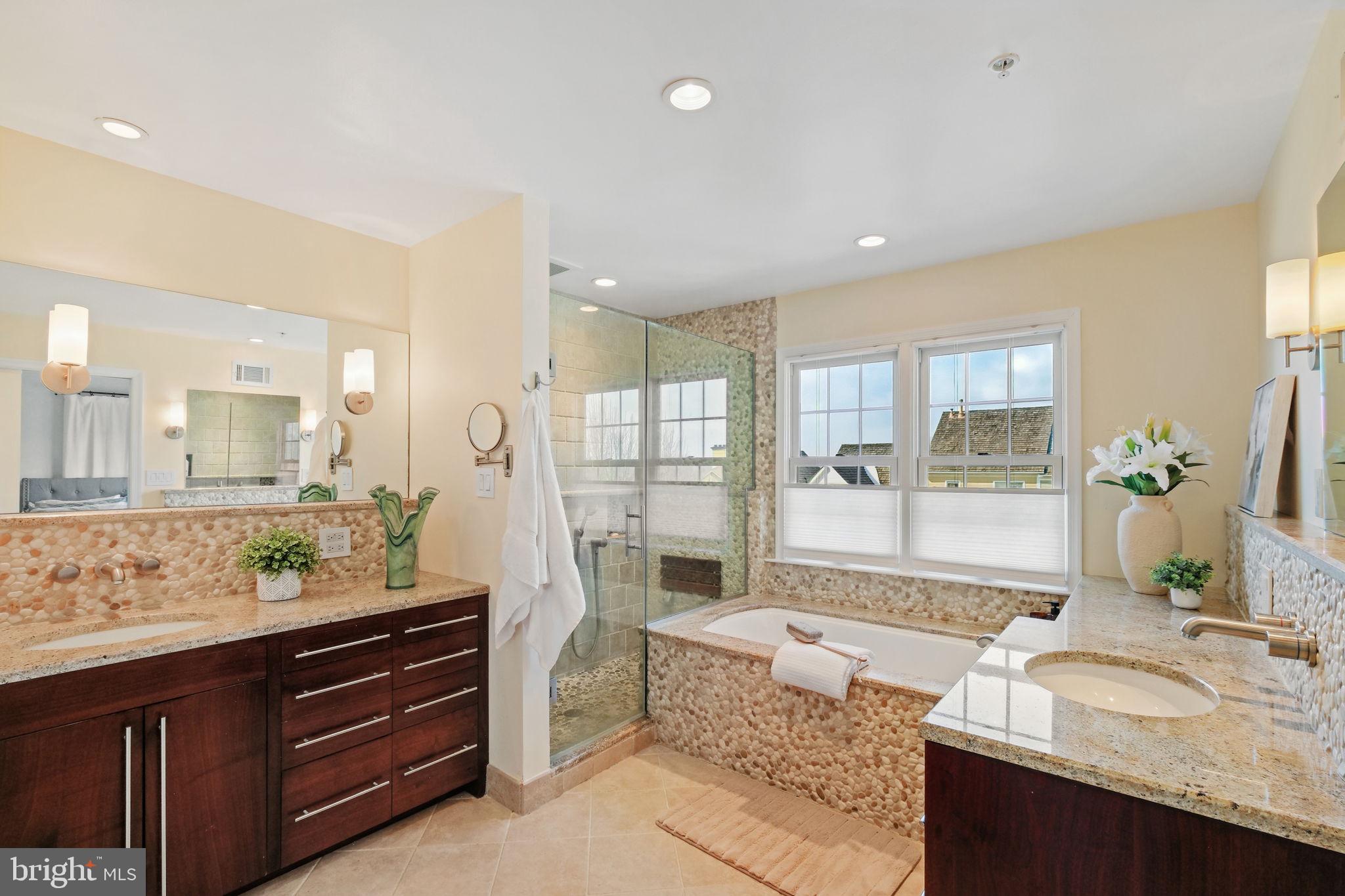220 Thaxton Street Gaithersburg, MD 20878 - Photo 18 of 61 a spacious bathroom with a granite countertop tub sink and mirror