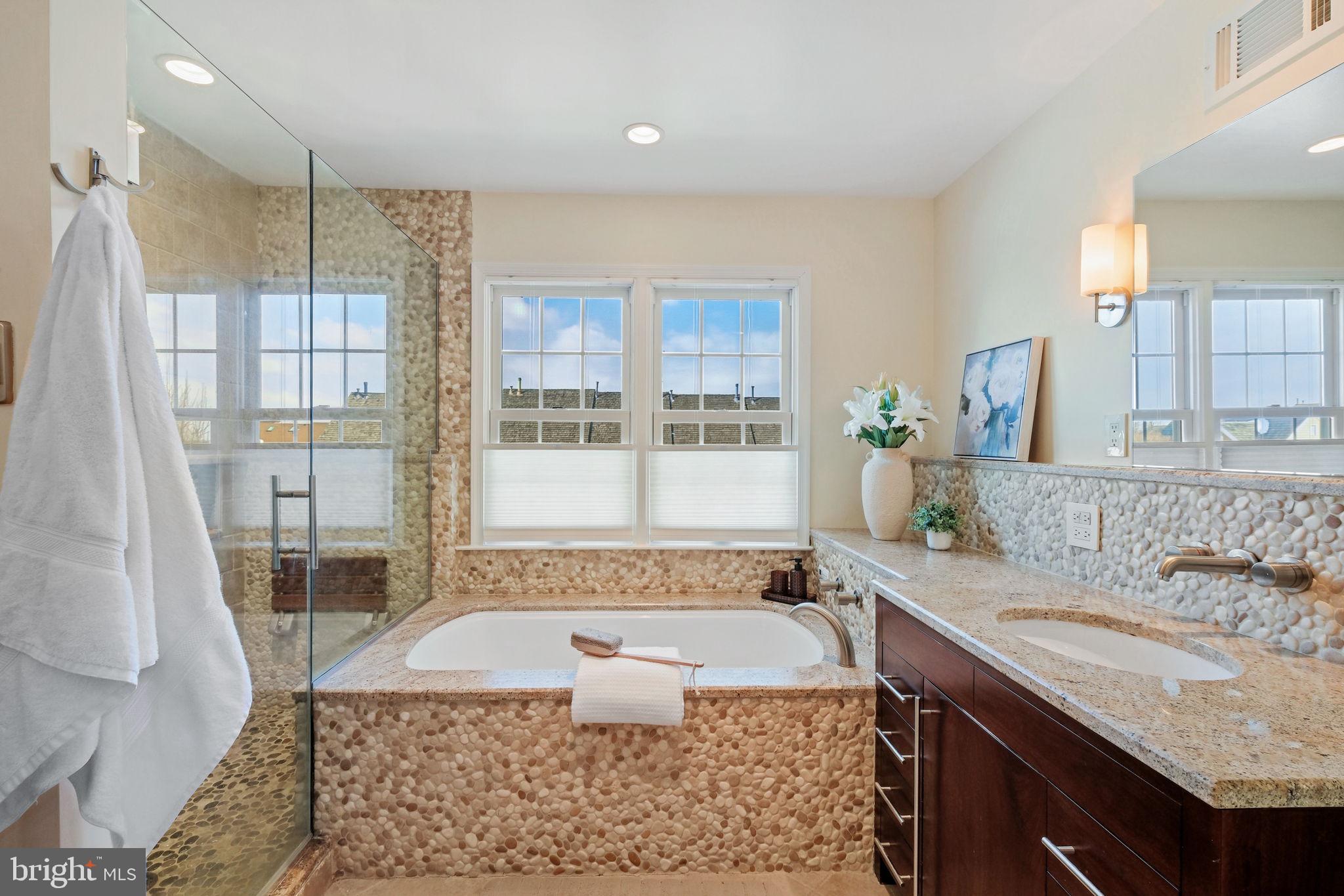 220 Thaxton Street Gaithersburg, MD 20878 - Photo 19 of 61 a bathroom with a granite countertop tub sink and glass door