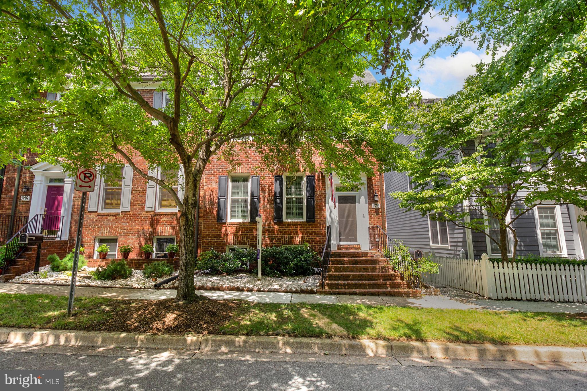 220 Thaxton Street Gaithersburg, MD 20878 - Photo 2 of 61 a front view of a house with a yard and tree s