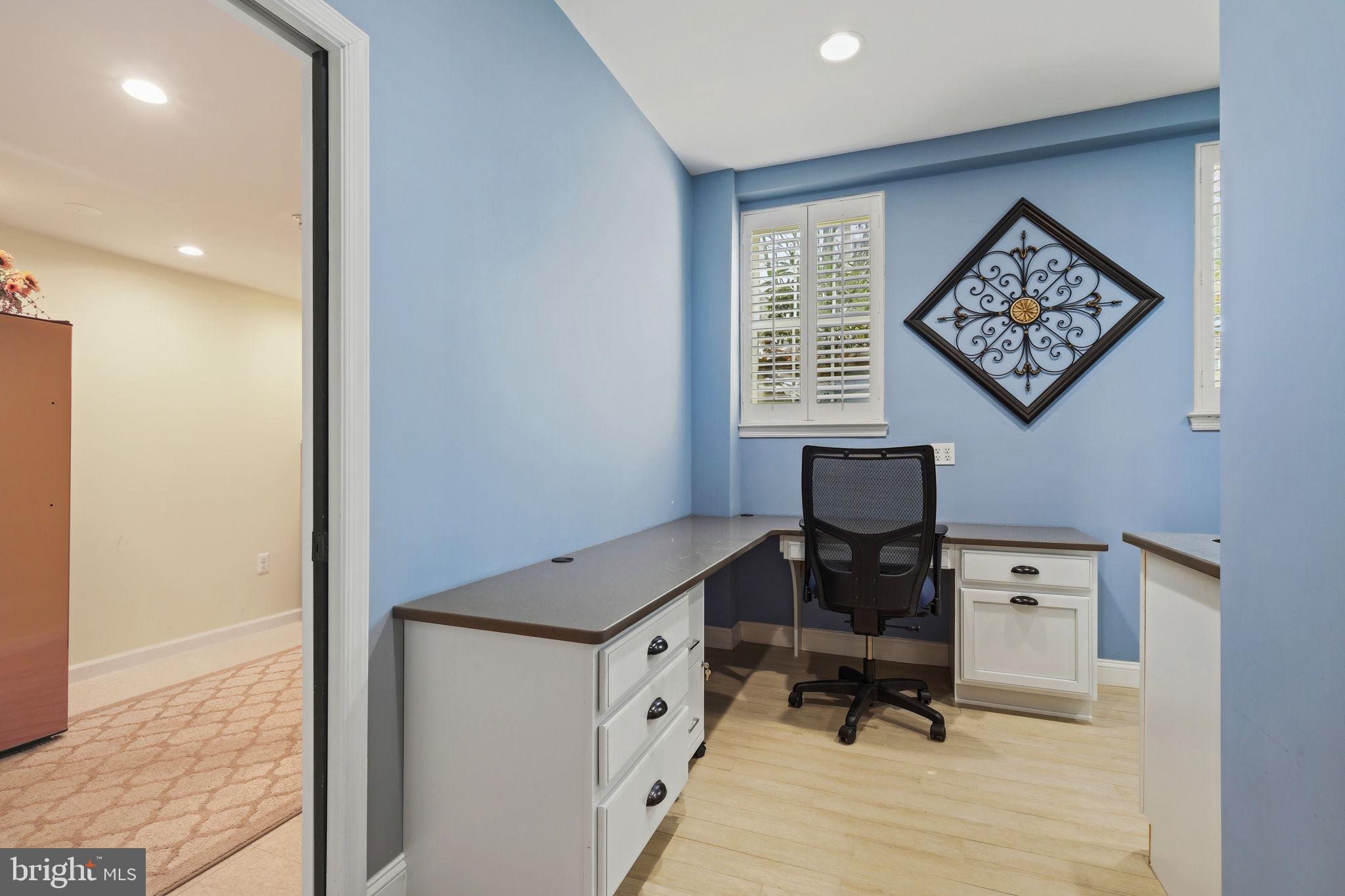 220 Thaxton Street Gaithersburg, MD 20878 - Photo 27 of 61 a view of a workspace with furniture and a window