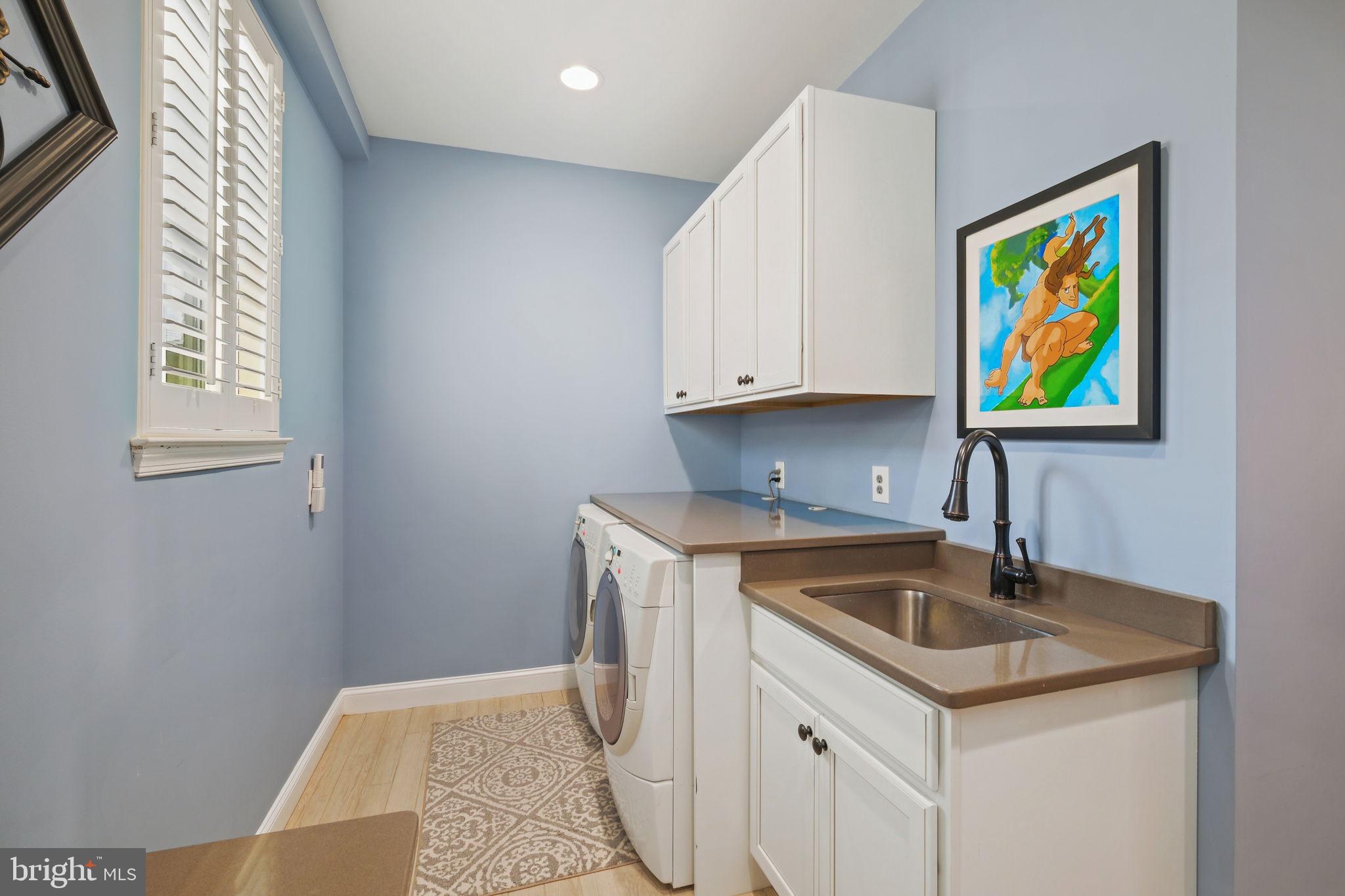 220 Thaxton Street Gaithersburg, MD 20878 - Photo 28 of 61 a kitchen with stainless steel appliances granite countertop a sink and a wooden cabinets