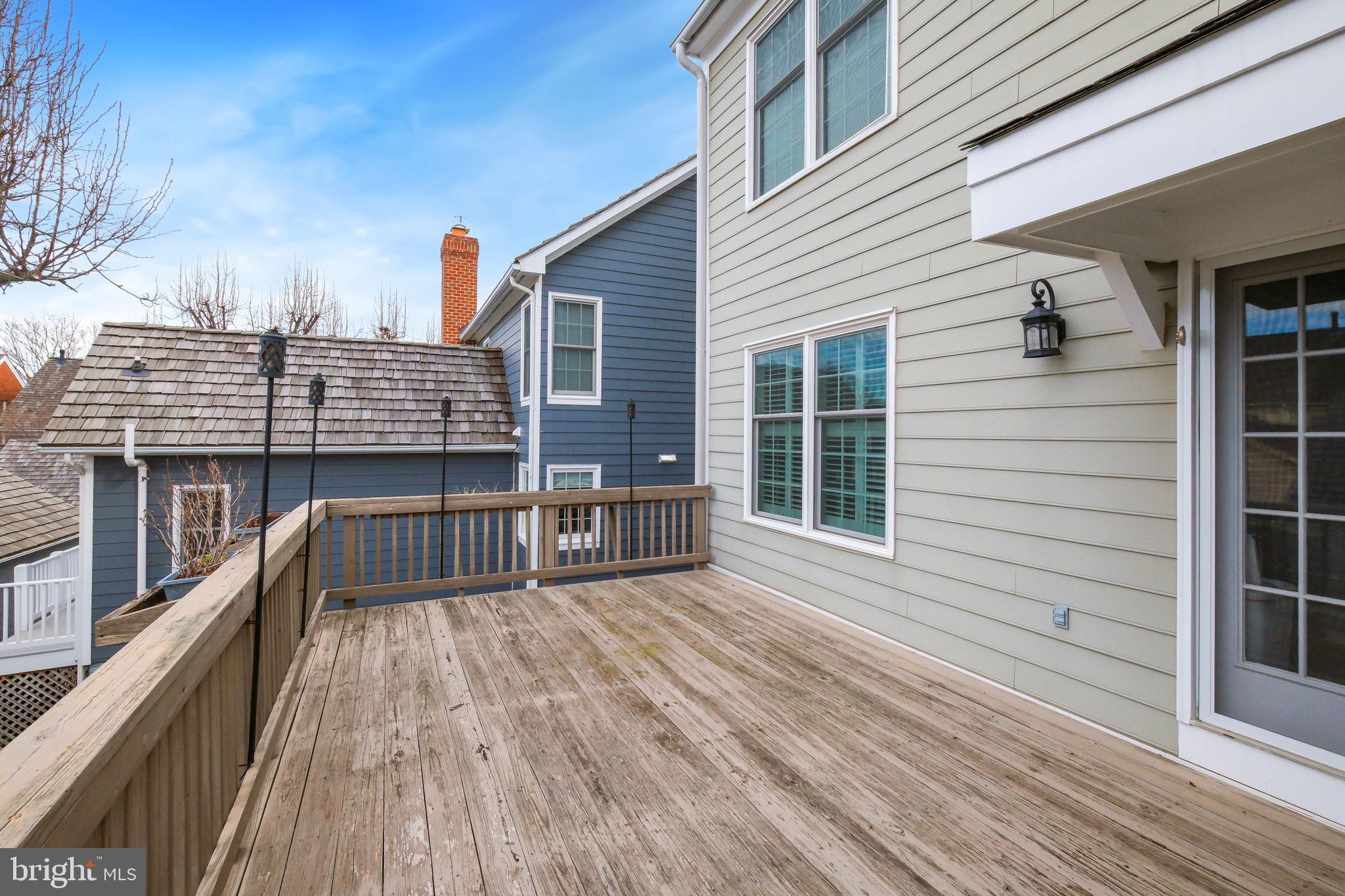 220 Thaxton Street Gaithersburg, MD 20878 - Photo 31 of 61 a view of balcony with deck and wooden floor