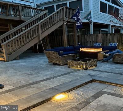 220 Thaxton Street Gaithersburg, MD 20878 - Photo 37 of 61 a view of a house with wooden deck and furniture