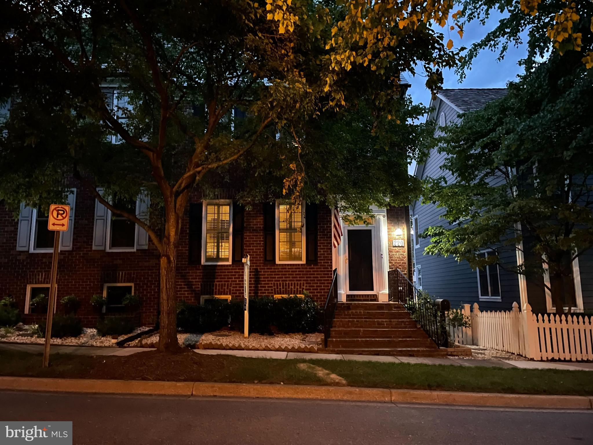 220 Thaxton Street Gaithersburg, MD 20878 - Photo 4 of 61 a front view of a house with a tree