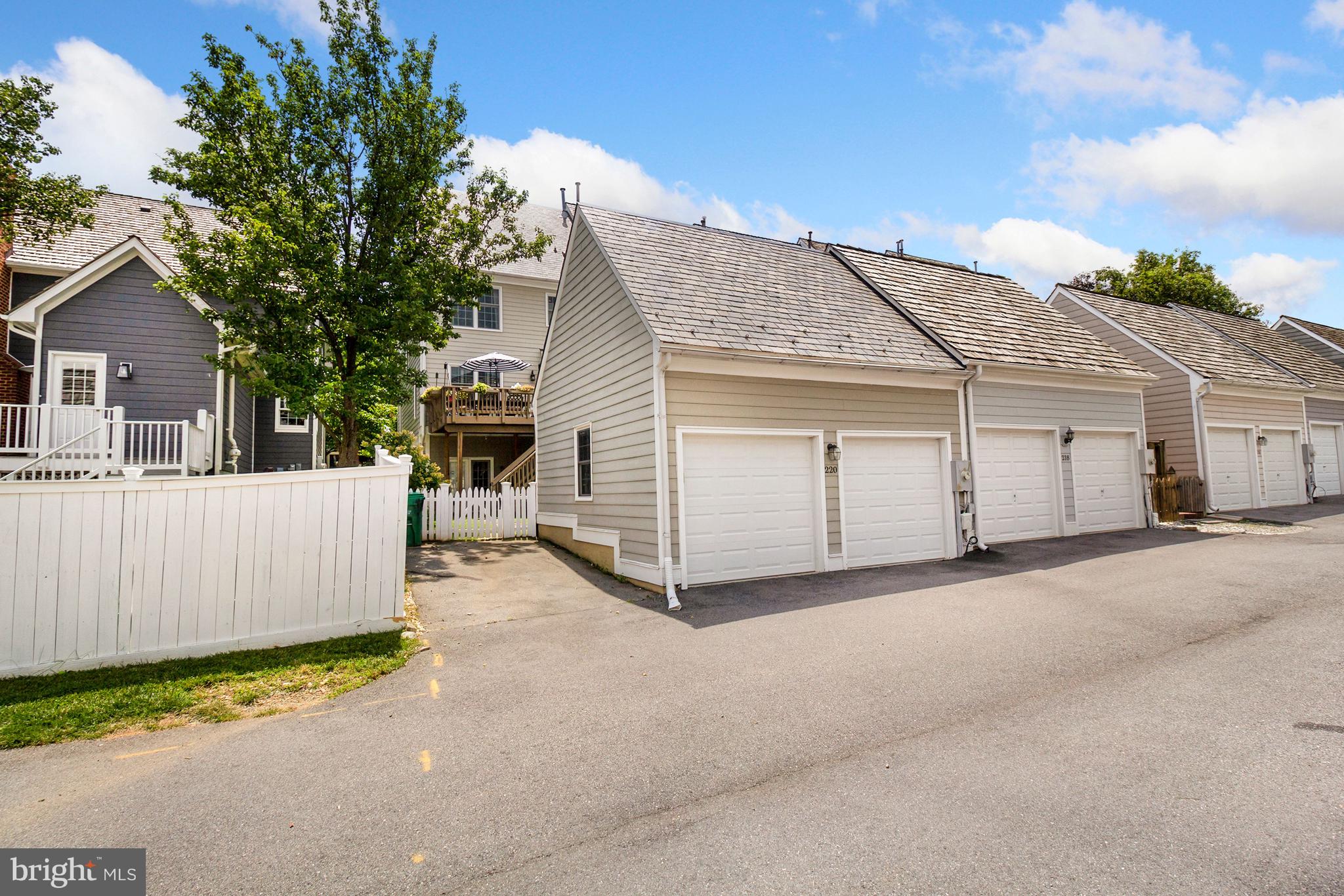 220 Thaxton Street Gaithersburg, MD 20878 - Photo 47 of 61 a view of a house with a garage and yard