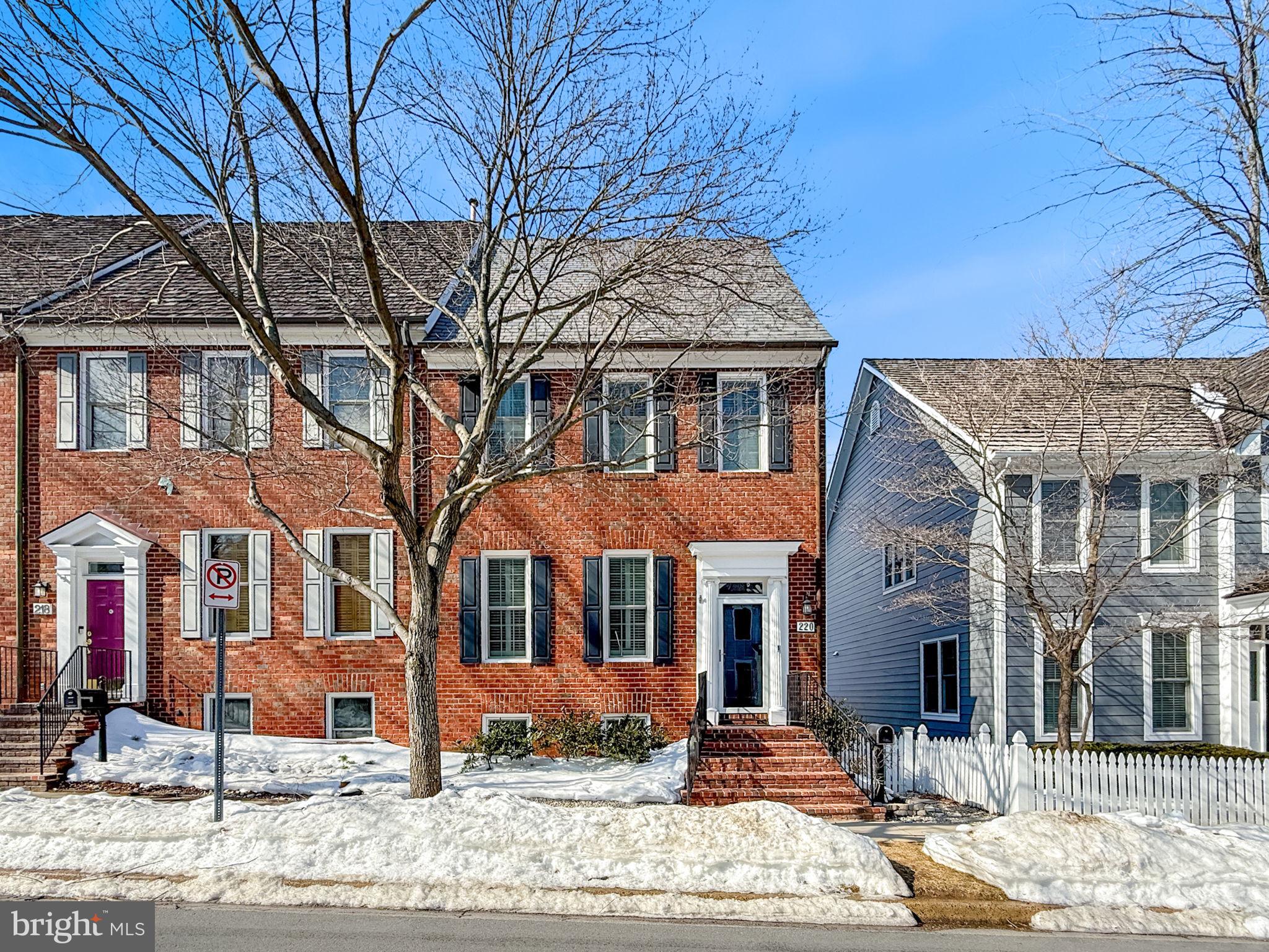 220 Thaxton Street Gaithersburg, MD 20878 - Photo 5 of 61 a front view of a building with a yard