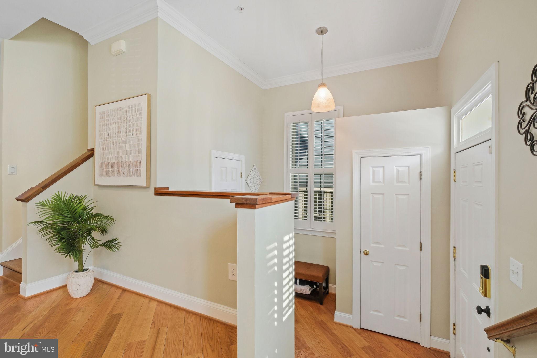 220 Thaxton Street Gaithersburg, MD 20878 - Photo 7 of 61 a view of livingroom with furniture and wooden floor