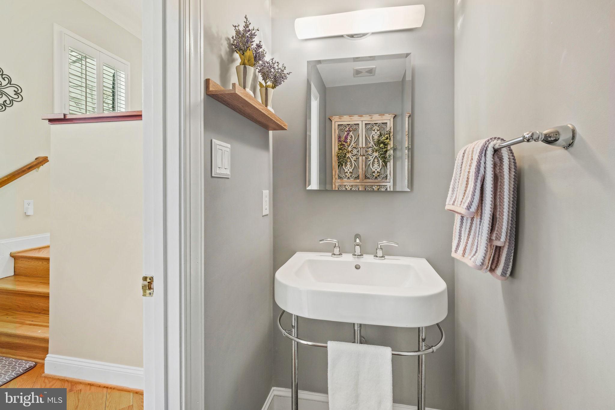 220 Thaxton Street Gaithersburg, MD 20878 - Photo 8 of 61 a bathroom with a sink and a mirror
