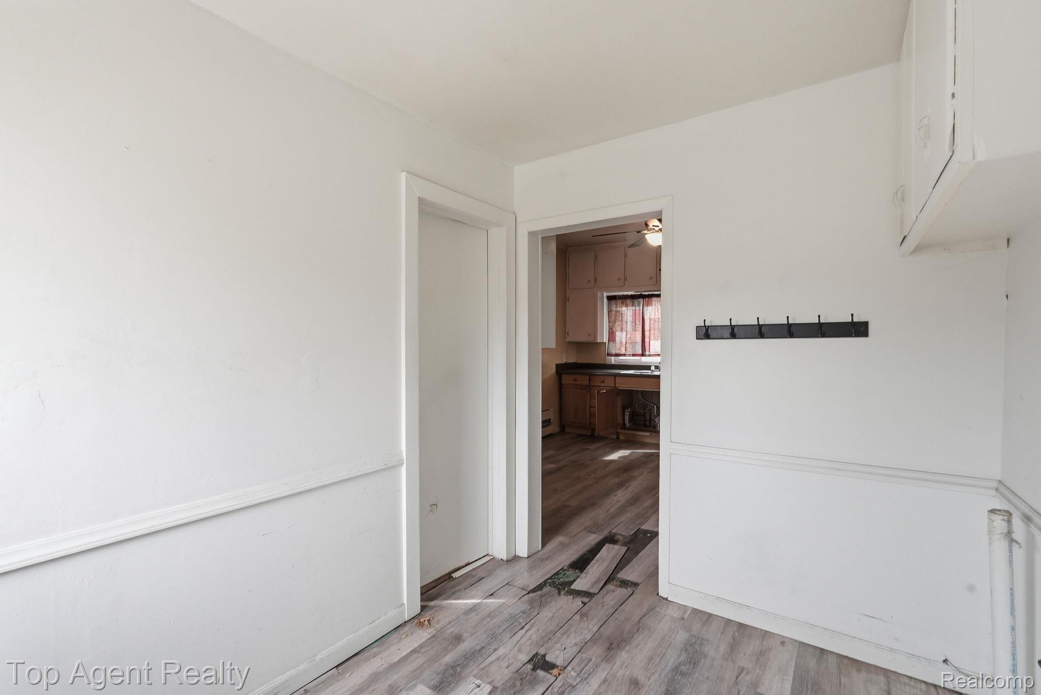 95 West Lapeer Road Peck, MI 48466 - Photo 22 of 33 Spare room featuring light wood-type flooring and ceiling fan