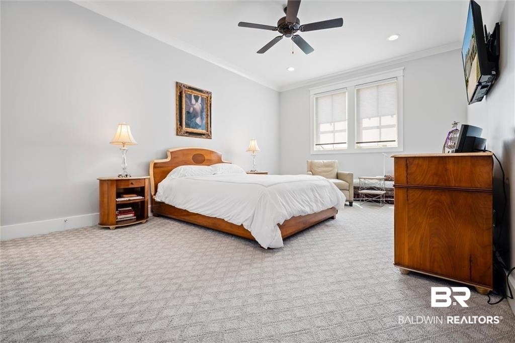 707 Cardamel Court Fairhope, AL 36532 - Photo 32 of 40 Bedroom with ornamental molding, carpet floors, and ceiling fan