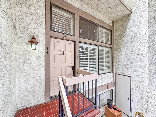 a view of a balcony with furniture