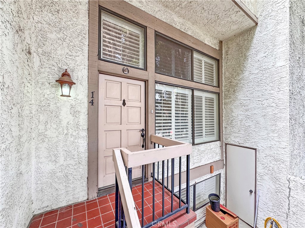 a view of a balcony with furniture