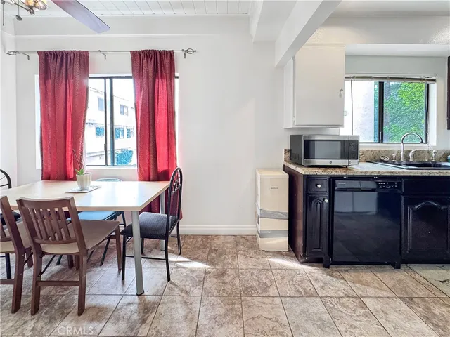 a kitchen with a stove a sink and a refrigerator
