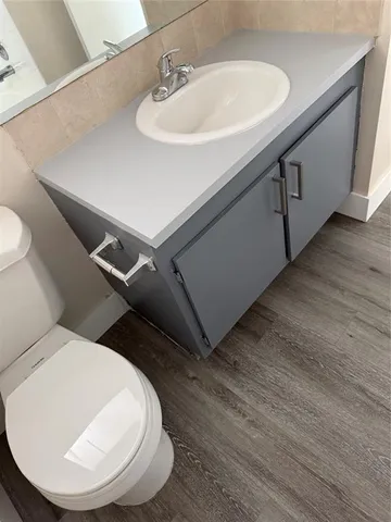 a bathroom with a sink and mirror