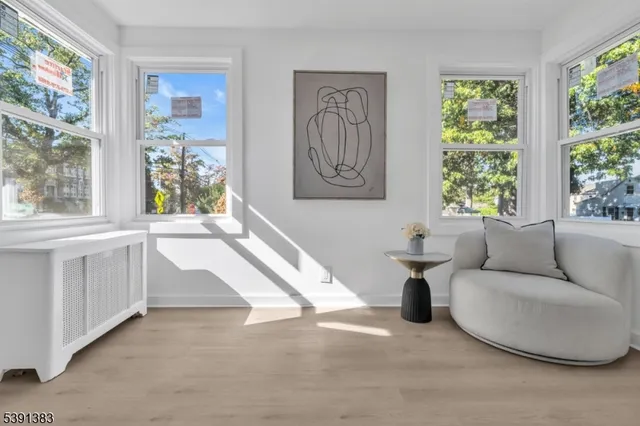 a living room with furniture and windows
