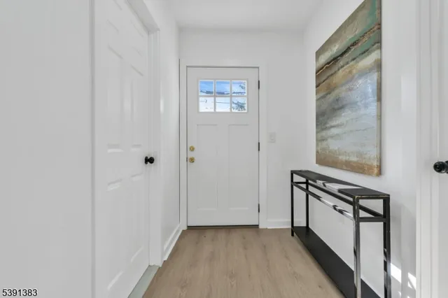 a view of a hallway with front door