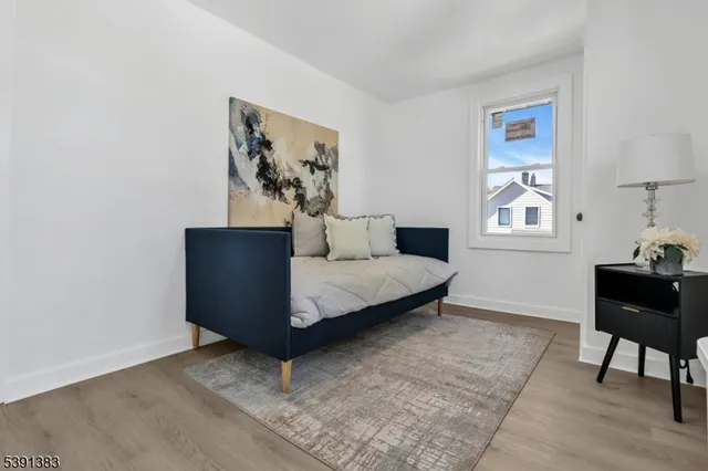 a bedroom with a bed and a table in it