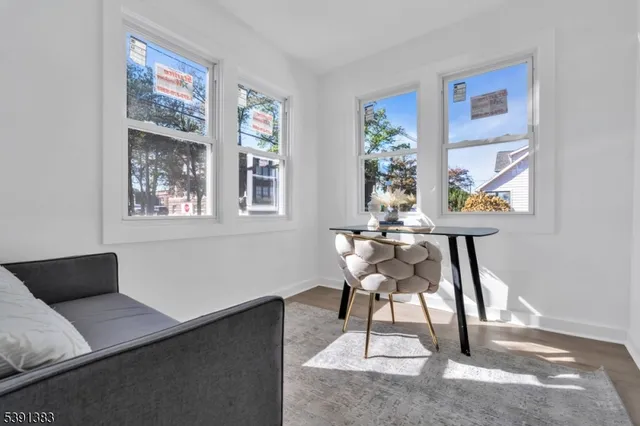 a work room with furniture and a window