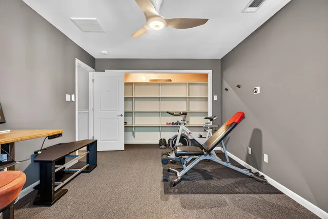 a view of a chairs and table in backyard