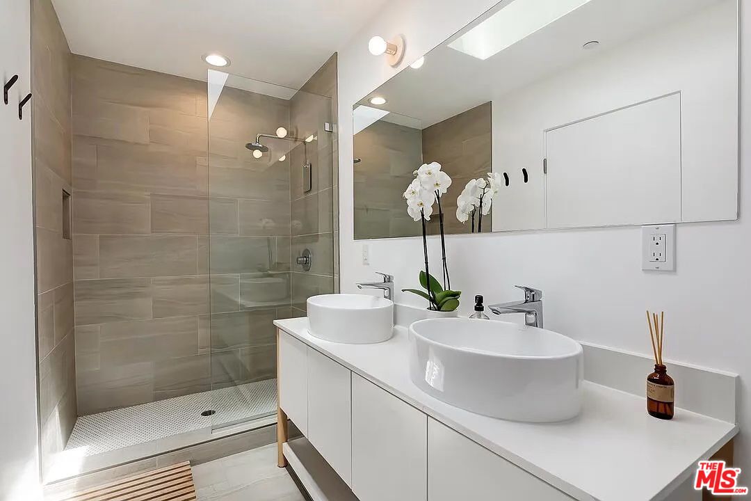 866 South Wilton Place Los Angeles, CA 90005 - Photo 11 of 17 a bathroom with a sink a toilet and shower