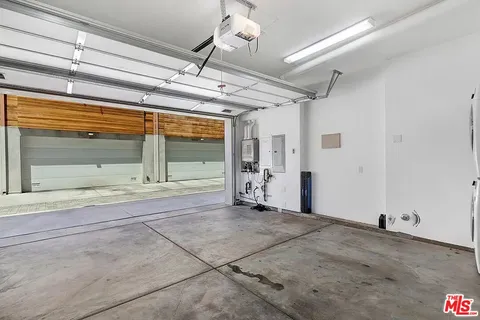 a view of a room with wooden floor and windows
