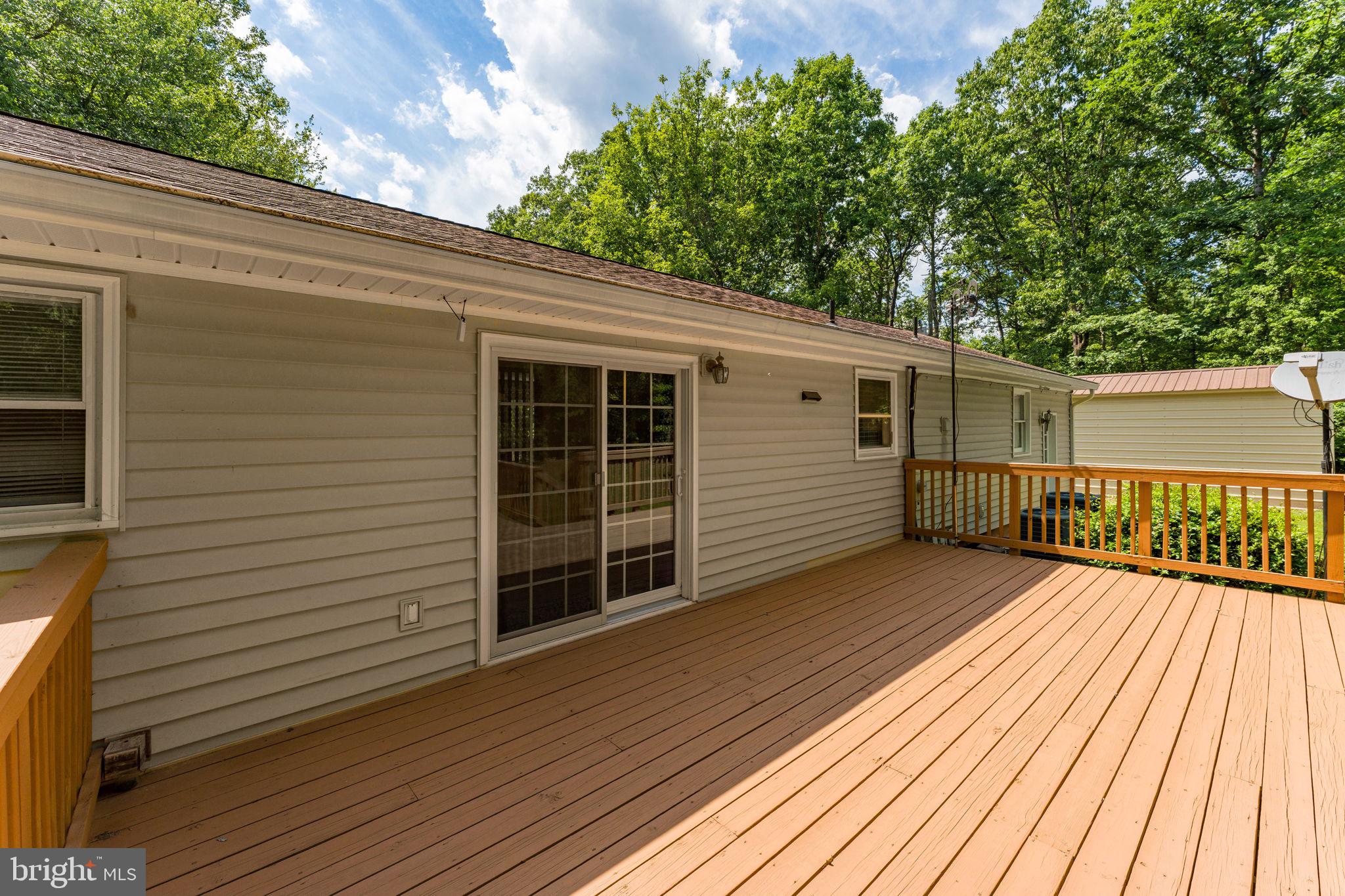 11053 Brent Town Road Catlett, VA 20119 - Photo 27 of 76 Sunny deck surrounded by lush greenery.