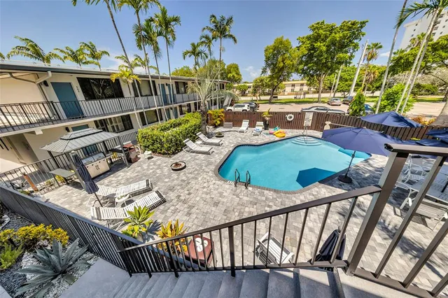 a balcony with table and chairs