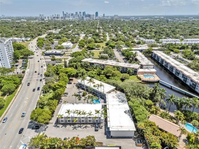 an aerial view of residential houses with outdoor space