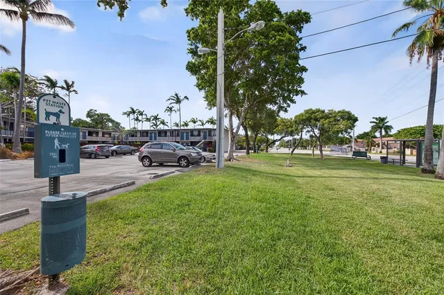 a view of a cars park in front of a house