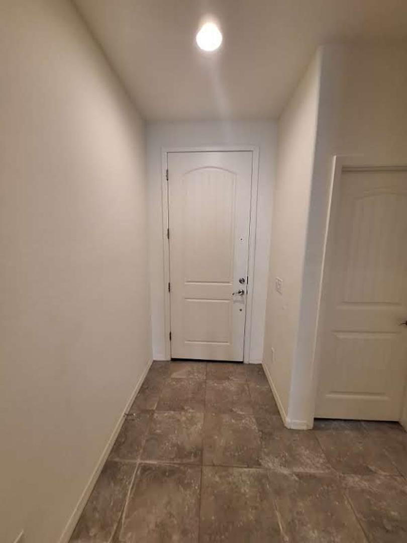 18541 West Mescal Street Surprise, AZ 85388 - Photo 26 of 31 an empty room with white door