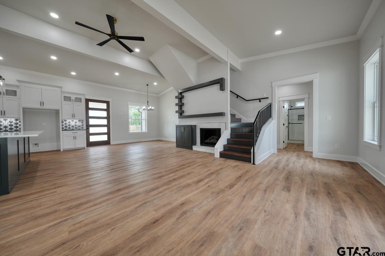 19383 Ridge Point Circle Lindale, TX 75771 - Photo 4 of 48 a view of a livingroom with a hardwood floor and a ceiling fan