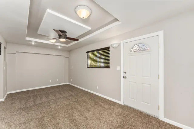 a kitchen with stainless steel appliances granite countertop a refrigerator a stove a microwave oven with a dining table and chairs