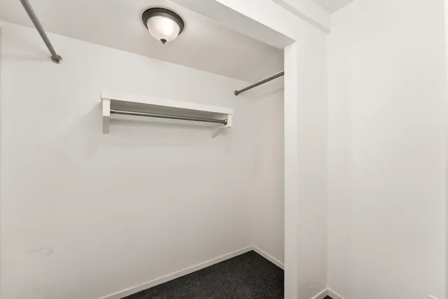 a view of a livingroom with washer and dryer