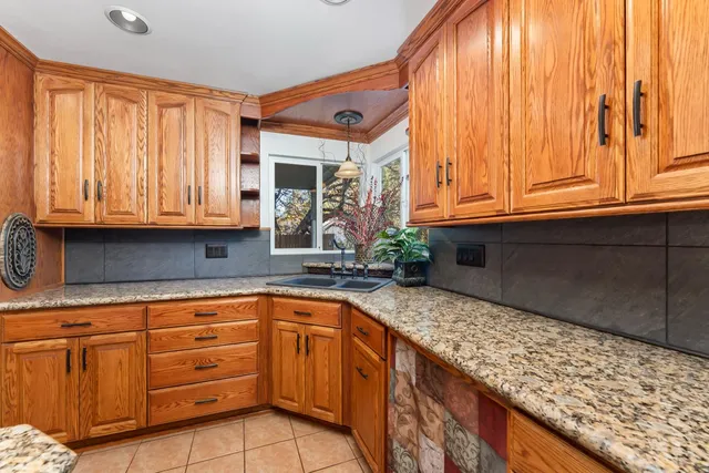 an empty room with a ceiling fan and a window