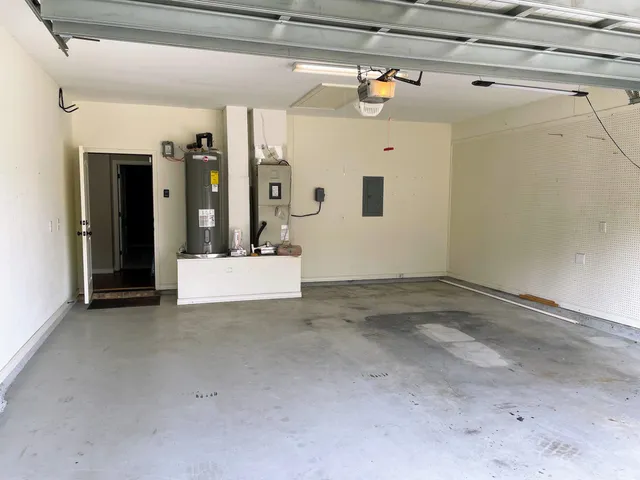 a view of a bedroom with bed and toys
