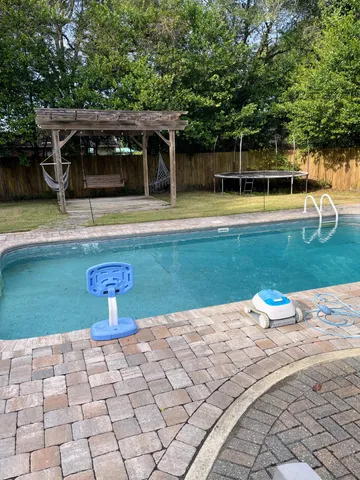 a view of a house with backyard
