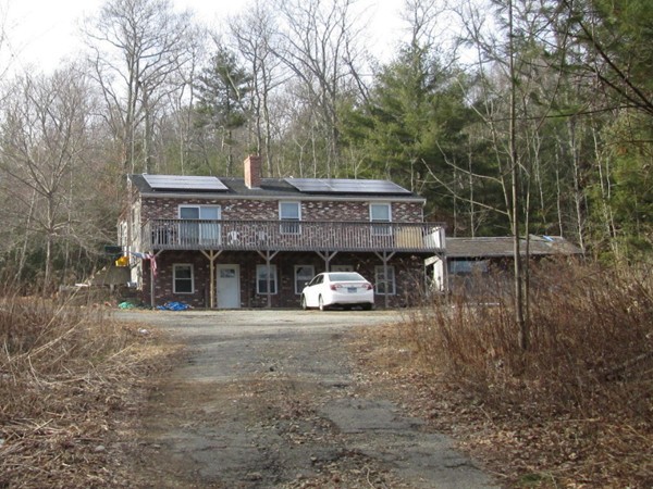 33 Douglas Road Webster, MA 01570 - Photo 1 of 13 a view of a house with a yard and balcony