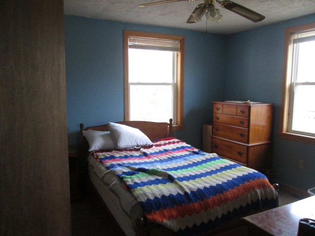 33 Douglas Road Webster, MA 01570 - Photo 13 of 13 a bedroom with a bed and a window