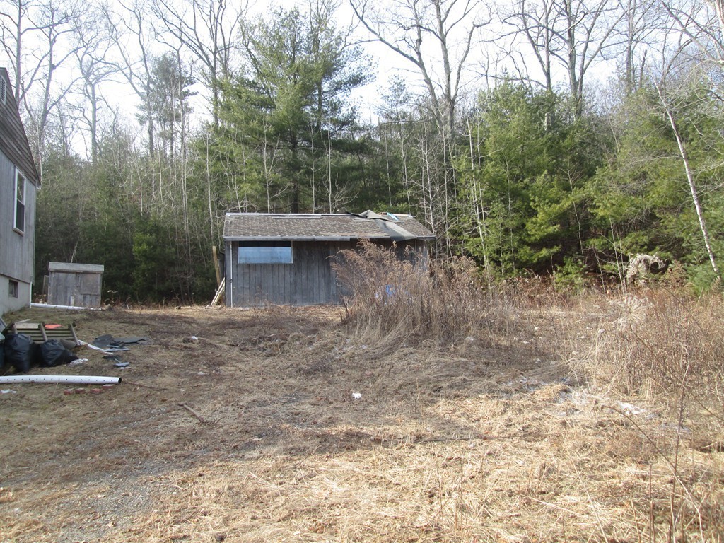 33 Douglas Road Webster, MA 01570 - Photo 5 of 13 a view of a back yard of the house