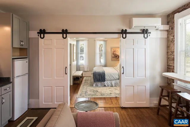 a bedroom with a bed and a table in it