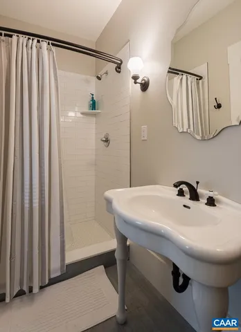 a bathroom with a sink and mirror