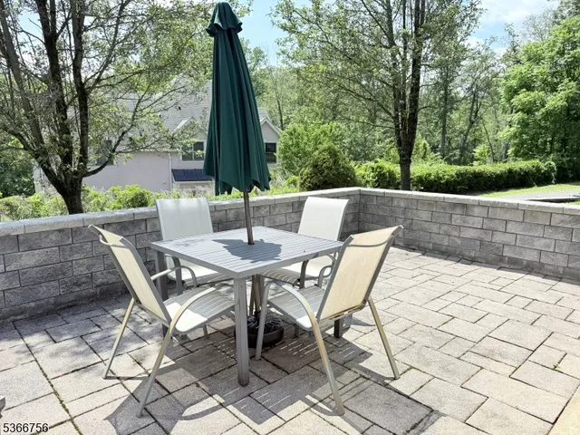 a view of an outdoor space with a table and chairs