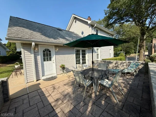 a patio with table and chairs