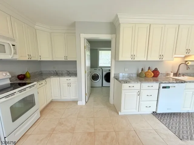 a kitchen with cabinets and appliances