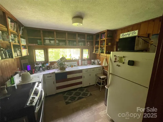 a bathroom with a sink mirror vanity and toilet