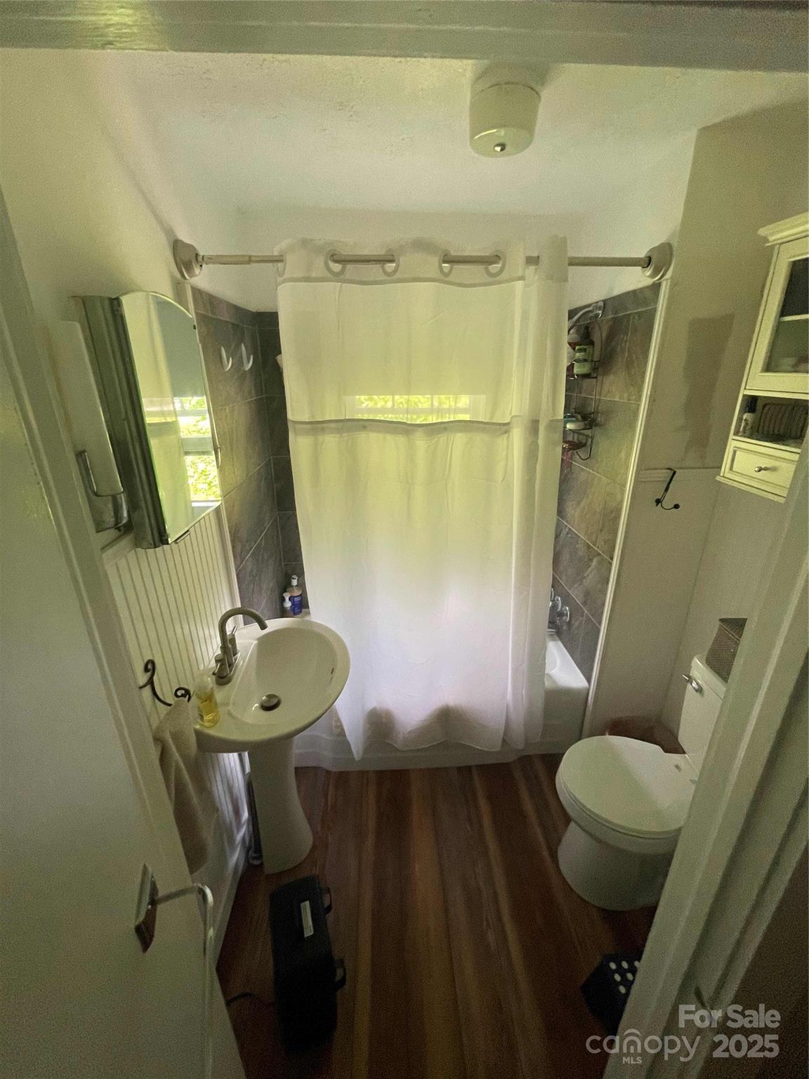 37 South US 19e Highway Newland, NC 28657 - Photo 7 of 16 a bathroom with a sink mirror vanity and toilet