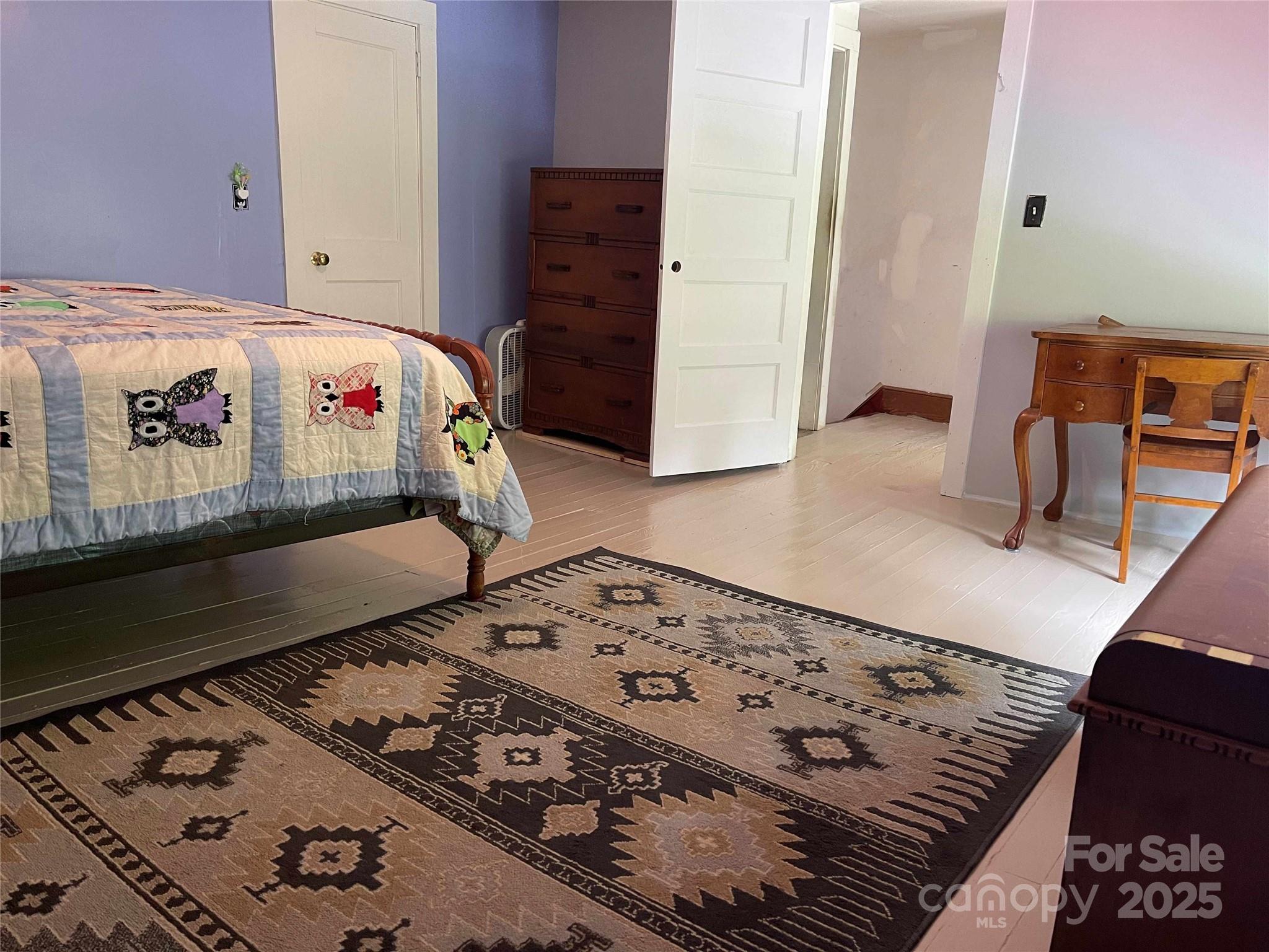 37 South US 19e Highway Newland, NC 28657 - Photo 9 of 16 a view of a hallway with bed and wooden floor
