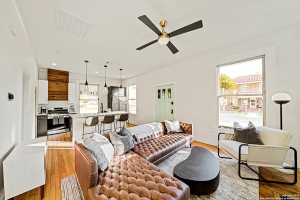 a living room with furniture and a large window