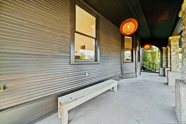 a view of a house with a potted plant